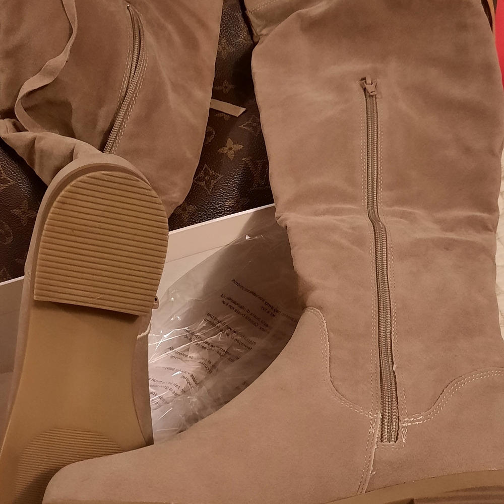 Pair high knee flat boots.